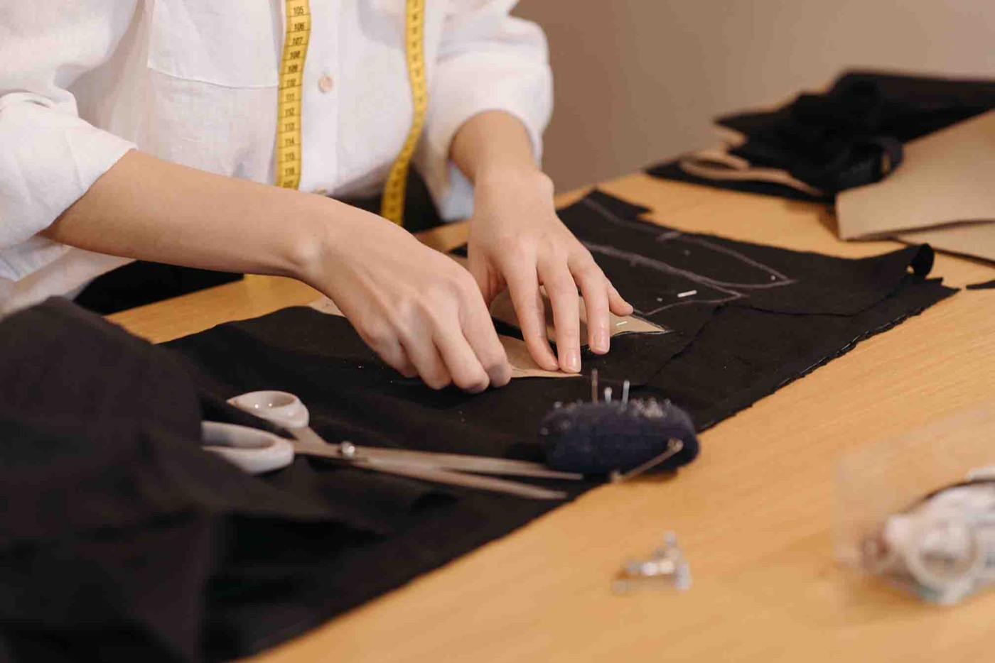 Tailoring tools and fabric on a work table